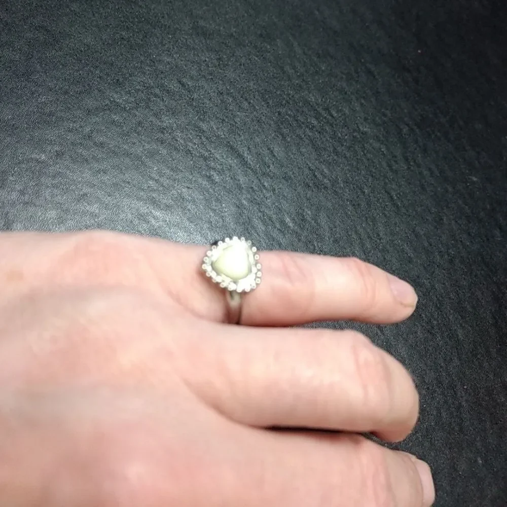 Silver tone adjustable cream heart ring